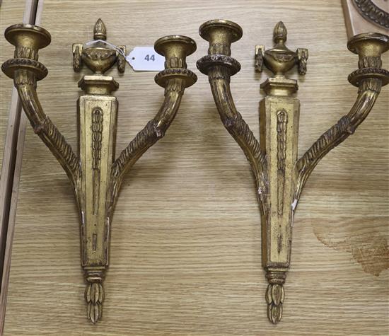 A pair of Louis XVI style carved giltwood two branch wall sconces height 42cm